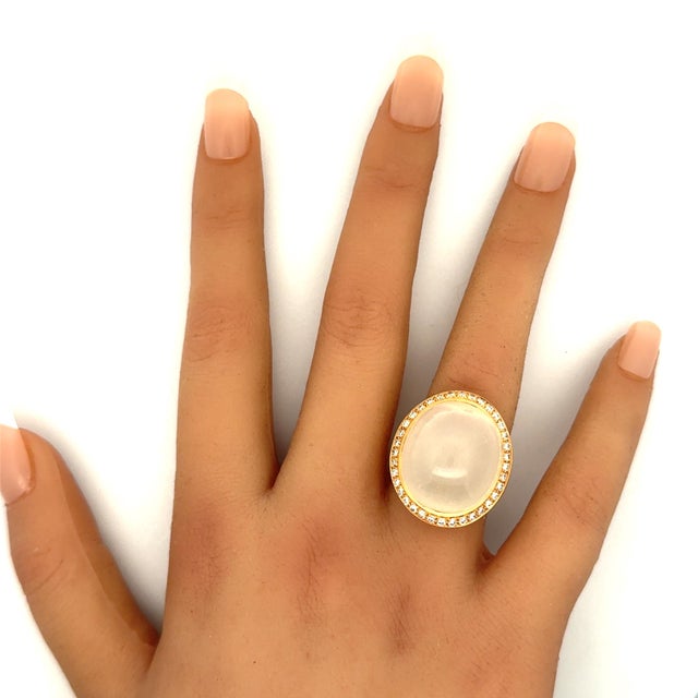 A contemporary cocktail ring crafted in 18k rose gold, featuring a captivating 33.01 carat moonstone with a soft white...