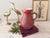 A striking vintage French ceramic pitcher by Accolay, dating from the mid-20th century. The sculptural form features a...