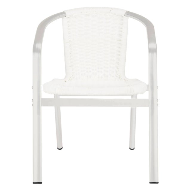 A modern iteration of the fan back chair, the white indoor-outdoor stacking armchair by is designed for parties in chic...