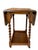 Charming antique English oak drop-leaf card table featuring beautifully turned barley-twist legs and a warm, richly aged...