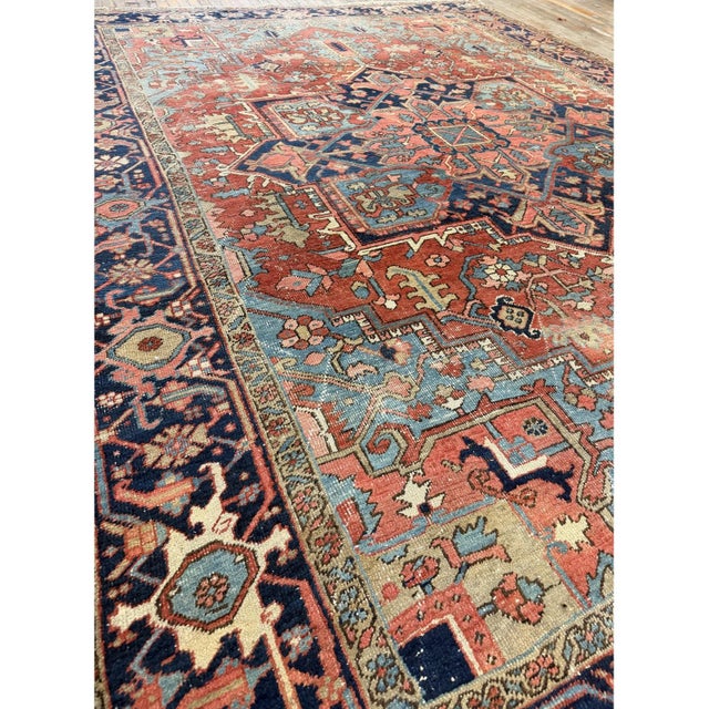 his late-19th-century Heriz carpet is a magnificent representation of the rustic weaving traditions from northern Persia....
