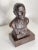 Heavy patinated bronze bust of a "Business Man" on a wooden base. It appears to have had an inscribed plaque attached in...