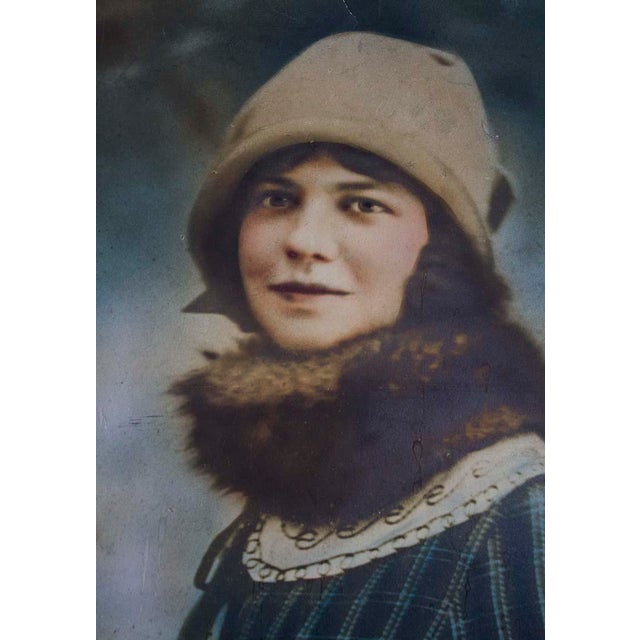 Rare hand colored photograph of a beautiful young woman from the deco era. Prominent in size, the outside measurement is...