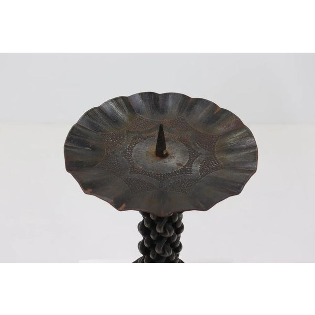 Heavy brutalist candle holder from the 1960s. Wrought iron with a lovely patina and beautiful details.