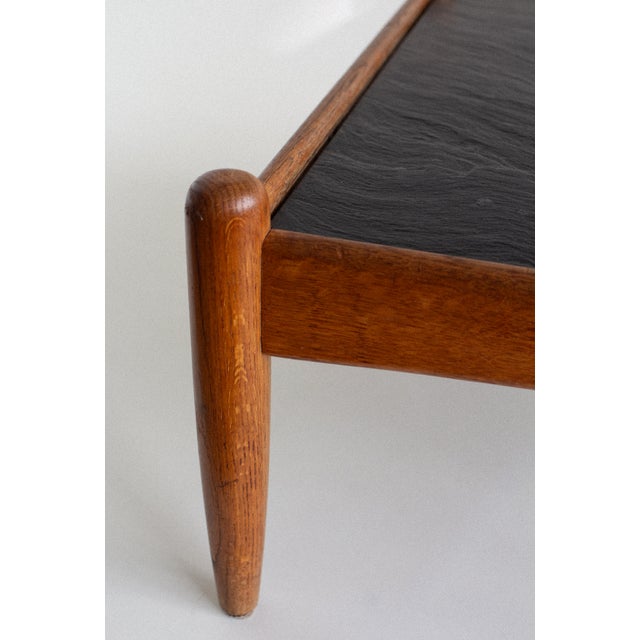 Designed by Swedish designer Eric Merthen in the 1960s, this coffee table balances architectural restraint with tactile...