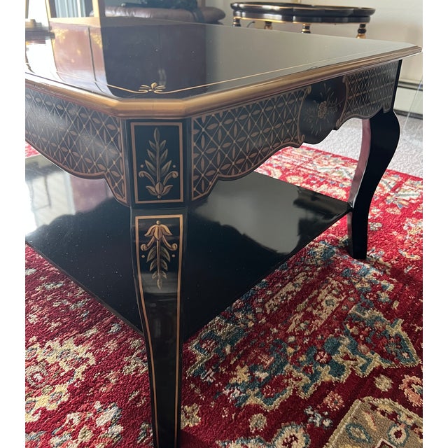 One of a kind, custom made, coffee table. Painted in black lacquer and hand painted all gold decorations and fine lines....