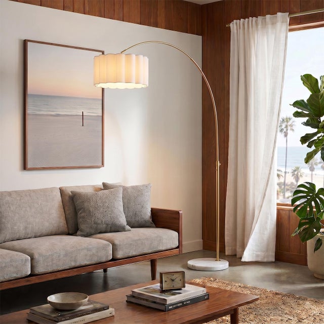 Constructed with weathered brass and a white marble base, the Scallop Arc Lamp is a modern masterpiece by designer Peter...