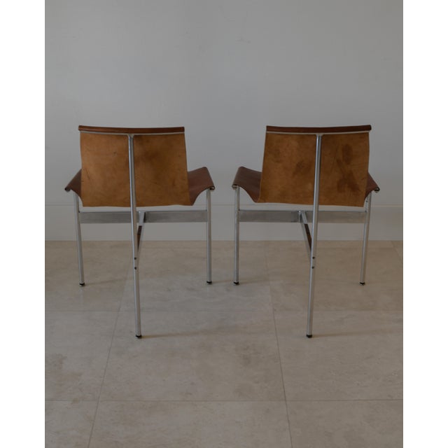 A beautiful pair of leather sling 'T-Chairs' by William Katavolos, Ross Littell and Douglas Kelly for Laverne...
