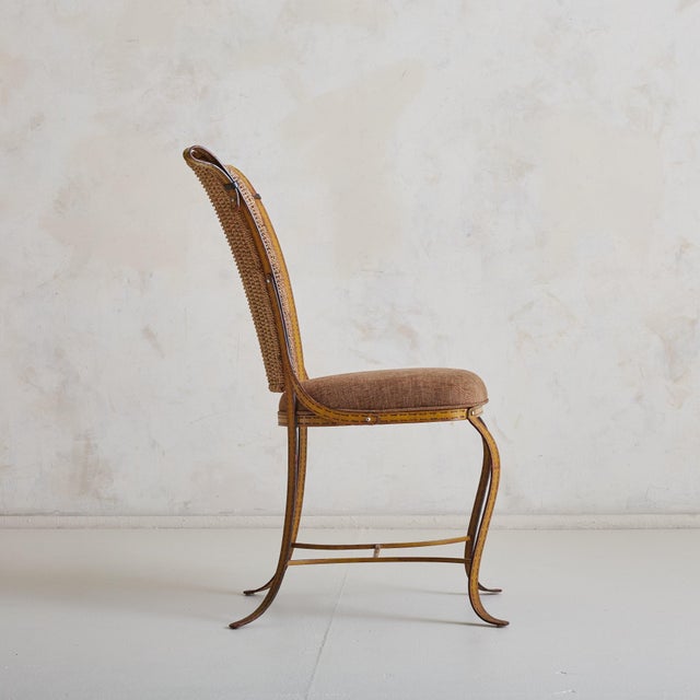 A 1960s French accent chair, attributed to Jacques Adnet, seamlessly blending raw texture with refined craftsmanship. The...