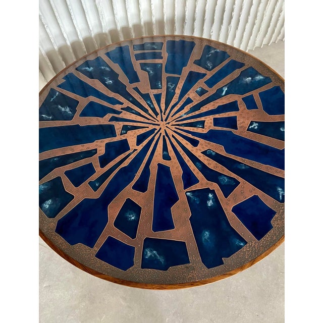 1960s h 50cm ø 121cm rare 1960s wooden coffee table with a stunning copper and enamel table top. The wooden base has a...