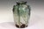 Manipulated Awaji pottery ring handled vase with slashes and dents covered with a thick, multicolored drip glaze, circa...