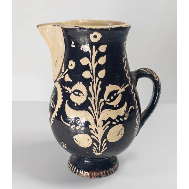 We are selling this cool folk art slip glazed pottery pitcher. This pitcher is probably 19th century and continental...