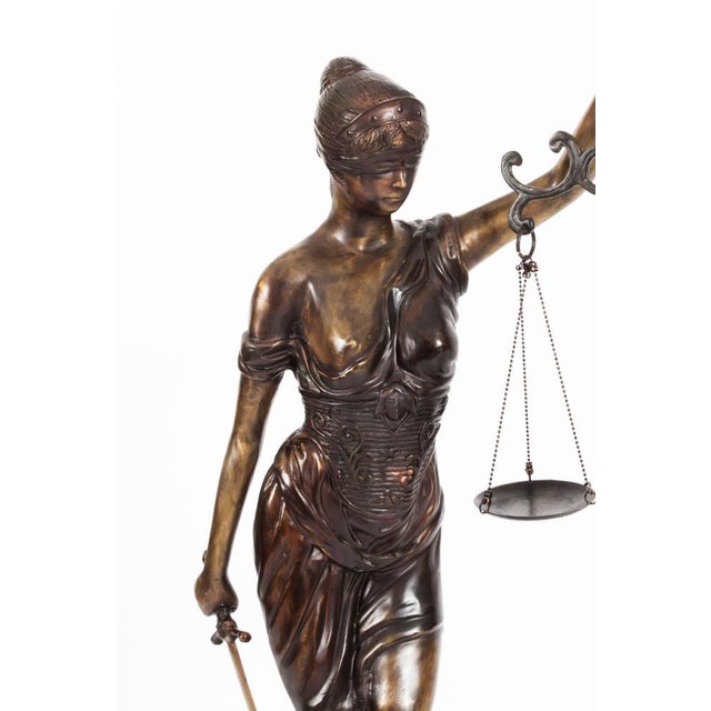 This is a truly stunning large bronze 'Lady Justice' statue set upon a bronze base, dating from the late 20th century....