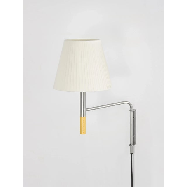 Natural bc1 wall lamp by santa & cole dimensions: d 20 x w 35 x h 44 cm materials: metal, beech wood, ribbon. Available in...