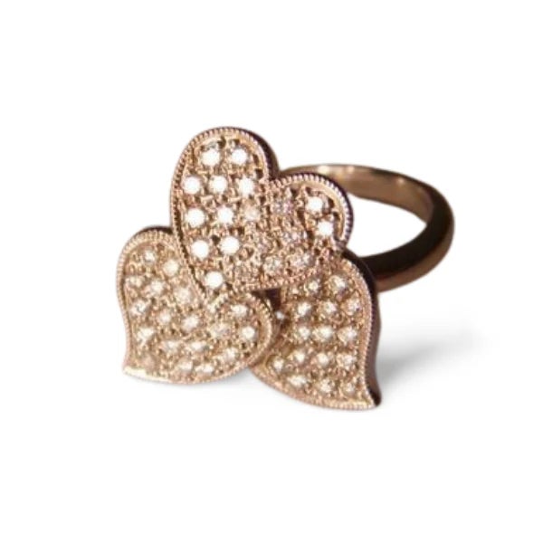 18K white gold designer ring featuring a romantic three-heart motif adorned with numerous brilliant round diamonds...