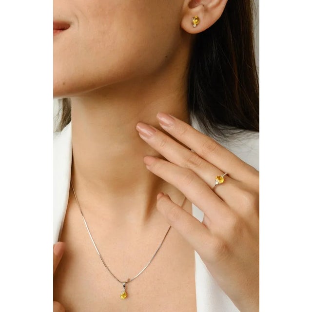 This is part of Chairish’s Fine Jewelry assortment. Yellow Sapphire and Diamond Ring, Pendant and Earrings Set 18K Gold to...