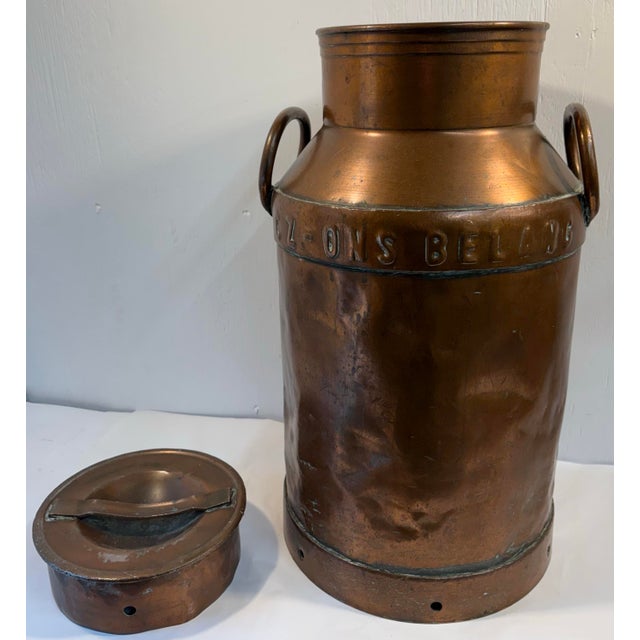 Gorgeous antique French copper milk can with writing on top indicating dairy name and product