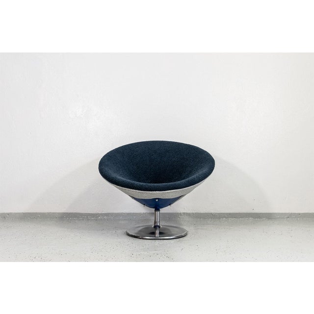 An cone armchair manufactured in Germany in the 1970s, representative of the Space Age design era. The piece features a...