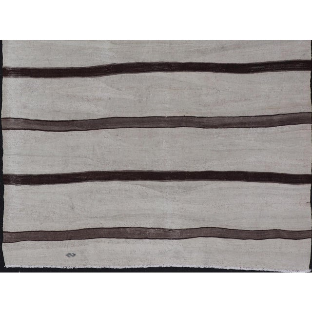 Measures: 4'5 x 6'0 Vintage Turkish Kilim Rug in Soft Beige and Dark Brown Stripes. Keivan Woven Arts / rug/EN-13650,...