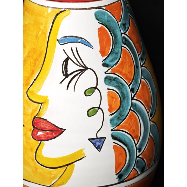Vietri ceramic vase, handcrafted and decorated with a vibrant, modernist-style pictorial composition featuring a stylized...