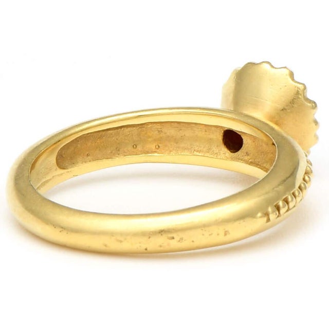 With an eye-catching design that enhances the rubellite tourmaline stone at its center, this piece is truly extraordinary....