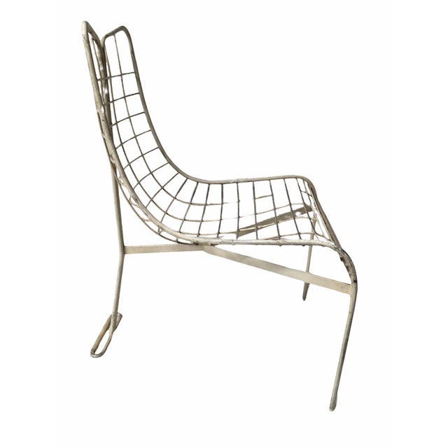 Vladimir Kagan, this Capricorn dining/accent chair features the iconic sculptural bent steel frame in a white finish....