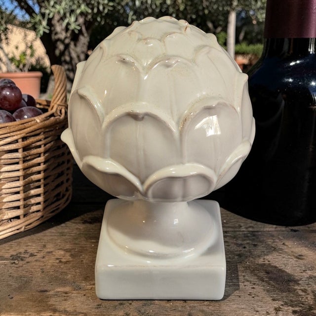 The Decorative Ceramic White Artichoke Sculpture is a beautifully crafted piece that adds a touch of elegance to any...