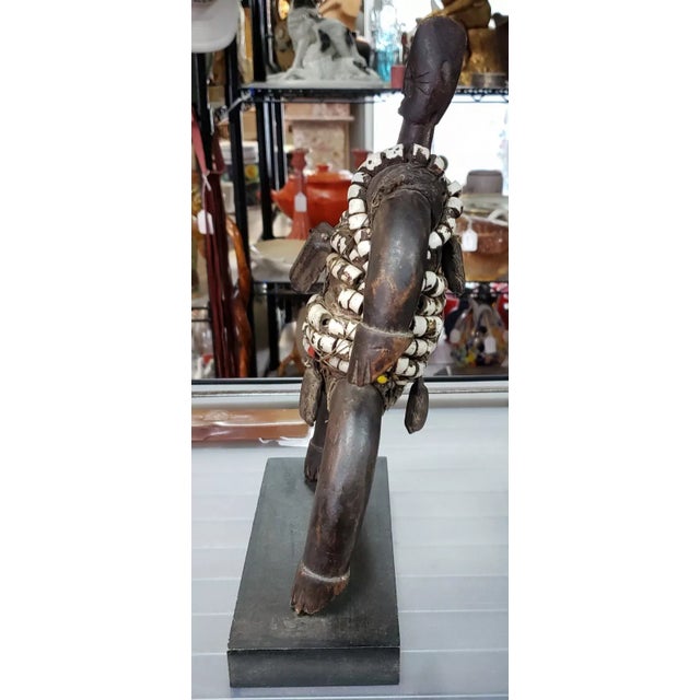 This is a 3rd Quarter 20th Century Namji Fertility Doll from Cameroon. It measures 11 7/16" tall, 7" wide and 3 1/8" deep....