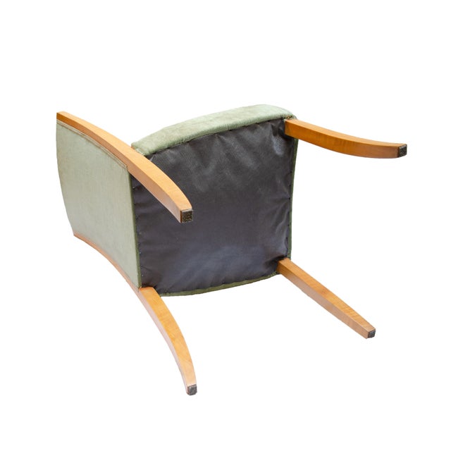 Central Europe, circa 1950–1955 This exceptional set of four armchairs embodies the elegance of the early Mid-Century era...