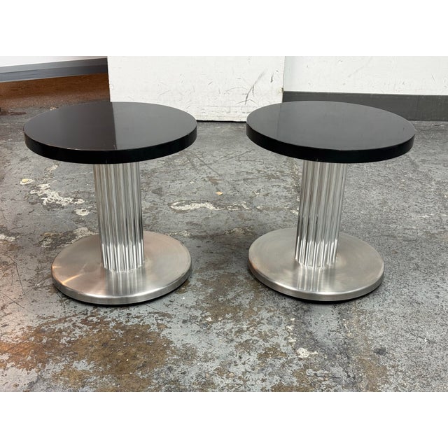 Design Plus Gallery presents a Pair of Vintage Art Deco Revival Pedestal Side Tables. The tables have round wood tops with...