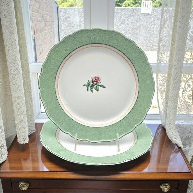 A matched pair of Wedgwood English Cottage Collection “Mist” dinner plates, manufactured between 2000 and 2005. Each plate...
