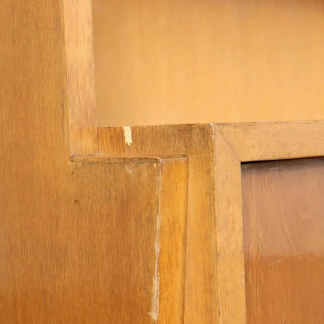 Bookcase unit with sliding glass doors and storage compartment with sliding doors in oak veneered wood. This piece is...