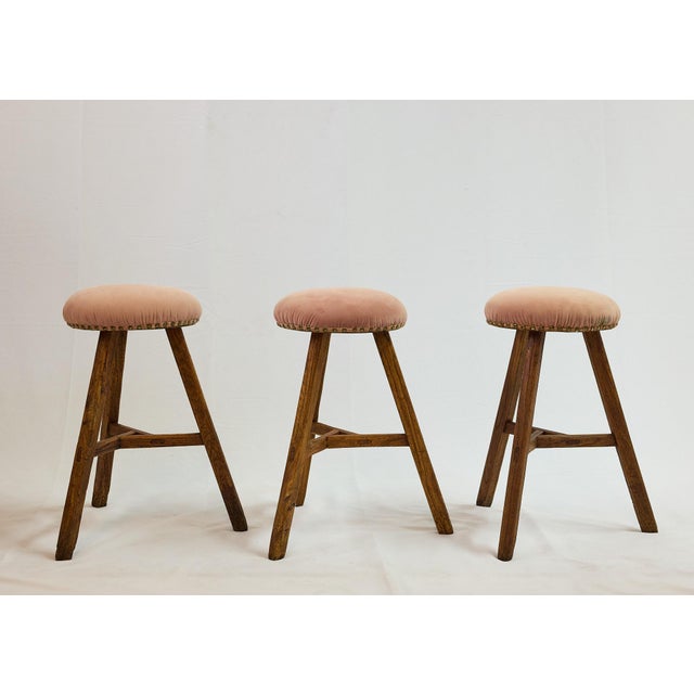 Set of three early 20th Century Italian milking stools with great primitive form and modern lines. Each stool has three...
