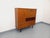 Vintage square bookcase in a Scandinavian modernist style from the 1950s/60s, made of teak with black metal legs and a...
