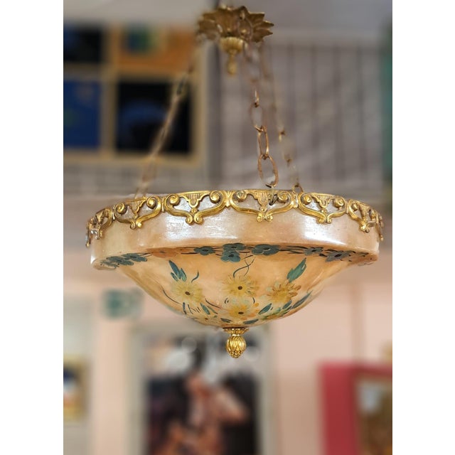 Beautiful ceiling lamp with an alabaster shade, bronze crown, and chains attached to the ceiling rose. It's French, in the...