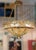 Beautiful ceiling lamp with an alabaster shade, bronze crown, and chains attached to the ceiling rose. It's French, in the...