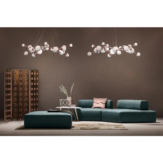 This unique black chandelier is all handmade in brass and steel, with a gold-plated finish on the body and lacquered a...