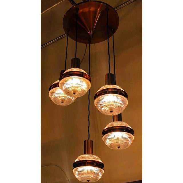 Original vintage Italian flush mount with height adjustable pendant lights made of beautiful textured glasses, mounted on...