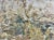 Layers upon layers of paint and other media, marked by incisions, have created a dense weathered texture that appears...