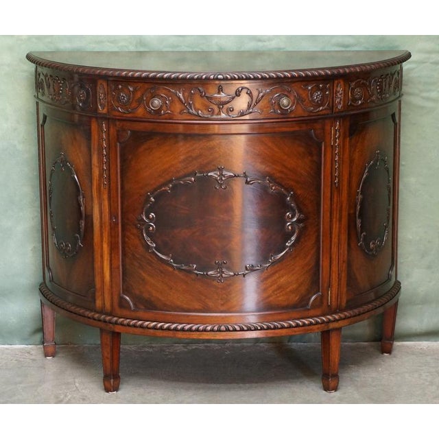 Fine Victorian Carved Mahogany Demi-Lune Side Cabinet, circa 1880 A handsome and beautifully proportioned English...