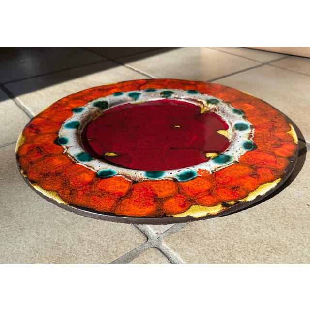 This impressive ceramic art wall plate was handcrafted by the renown German ceramist Reiner Gehrig during the 1970s. The...