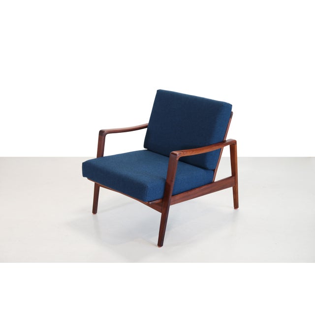 Beautifully organically shaped armchair designed by Arne Wahl Iversen for Komfort, Denmark. The frame is made of solid...