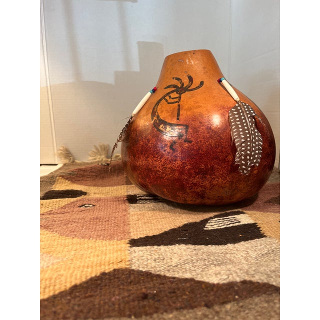 Fishes in a geometric pattern so very indicative of southwestern weavers. Gentle play of earth colors can highlight a...