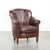 This charming and comfortable sheepskin armchair features a beautiful, deep dark color and elegant design, and is finished...