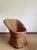 Charming French wicker lounge chair from the 1960s in a beautiful honey color featuring a beautifully organic silhouette...