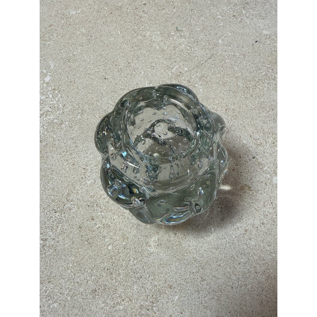 Charming vintage clear glass piece featuring an organic, rounded form with a textured bubble pattern throughout. The...