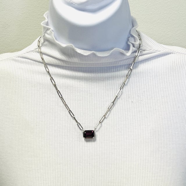 Beautiful unheated 5.44 ct. purple spinel emerald cut on a 14k white gold paper clip chain. Length is 18".