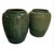 This striking pair of large-scale ceramic planters features a beautifully defined ovoid shape, narrowing gracefully toward...