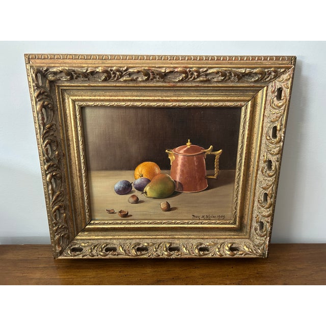 1959 Max H. Weiss Original Still Life Oil Painting – Fruit & Copper Teapot in Ornate Gold Carved Frame This exquisite...