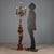 Late 19th-century floor lamp from Italy, featuring an artistic carved wooden base depicting a putto holding a candelabrum....